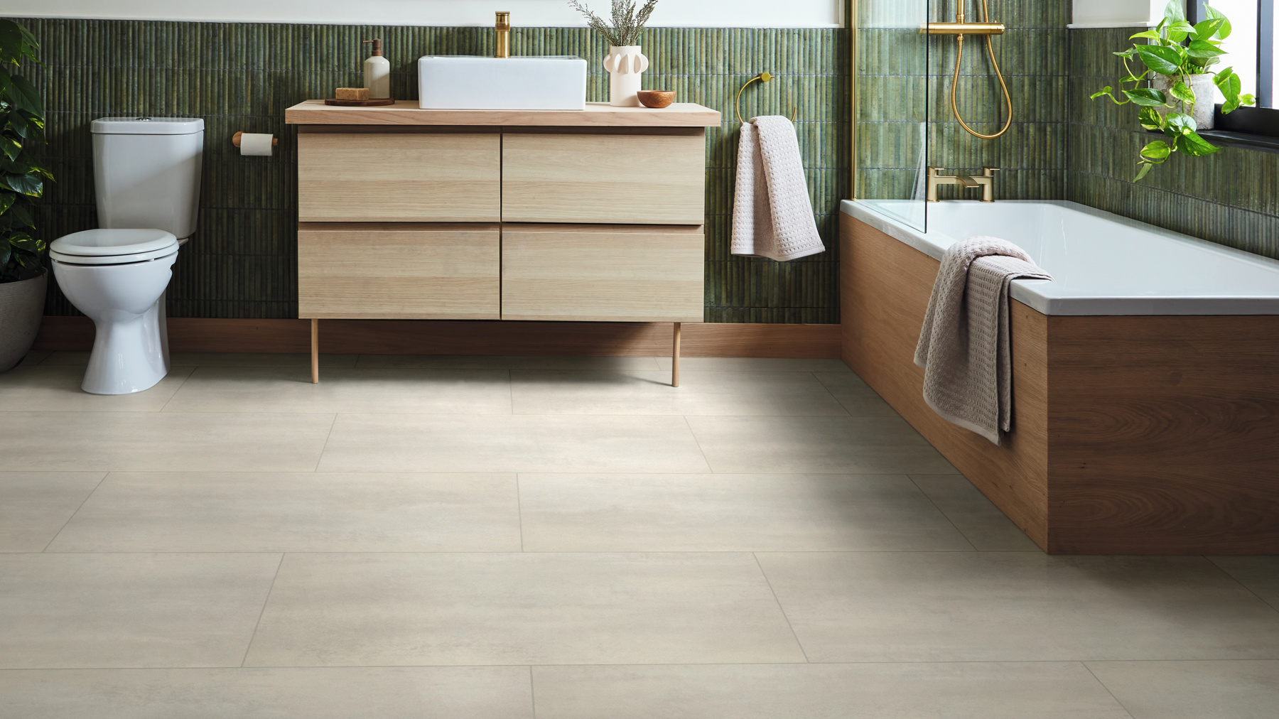 Stratus stone gluedown lvt floors in a bathroom with green tile accents