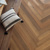 Golden Kent Ash gluedown RL44 wood lvt in a herringbone pattern