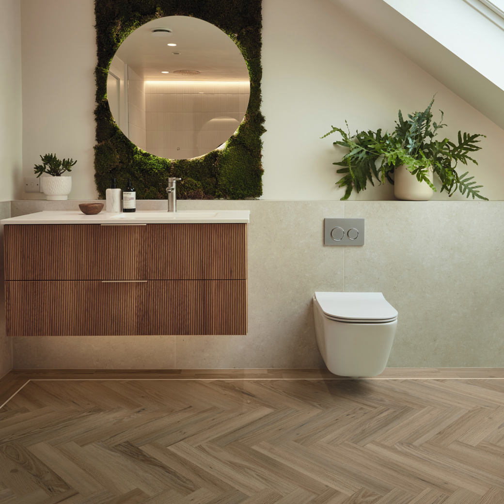 Duxbury Acacia herringbone wood LVT flooring in a bathroom